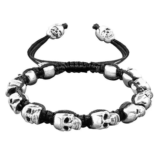 Pulsera tejida, con calaveras sonrientes plateadas