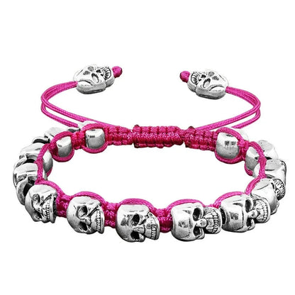 Pulsera tejida, con calaveras sonrientes plateadas