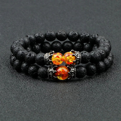 Pulsera de cuentas de ojo de tigre con dije de corona de piedra de Lava negra